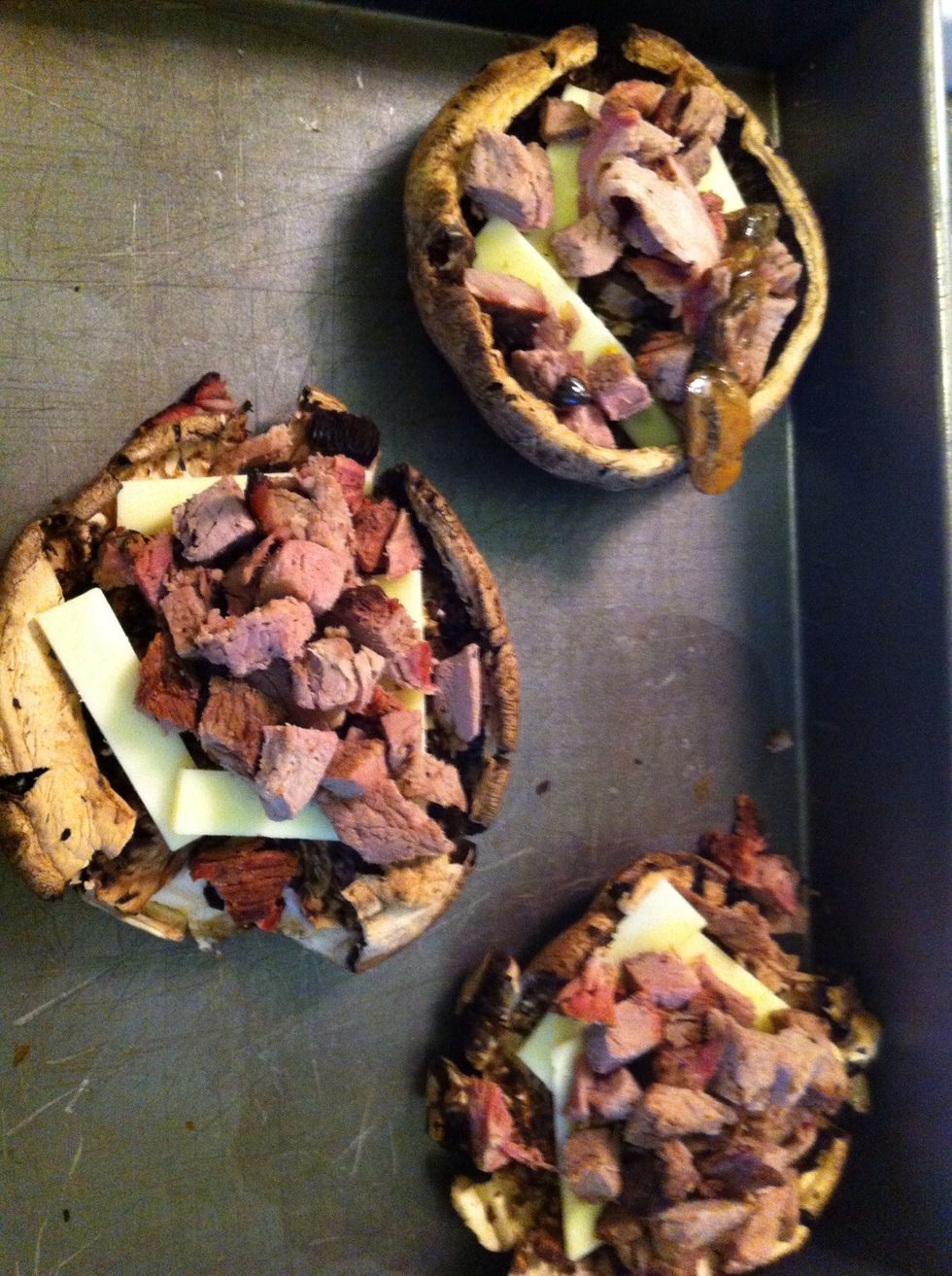Add the meat, mushrooms and more cheese.