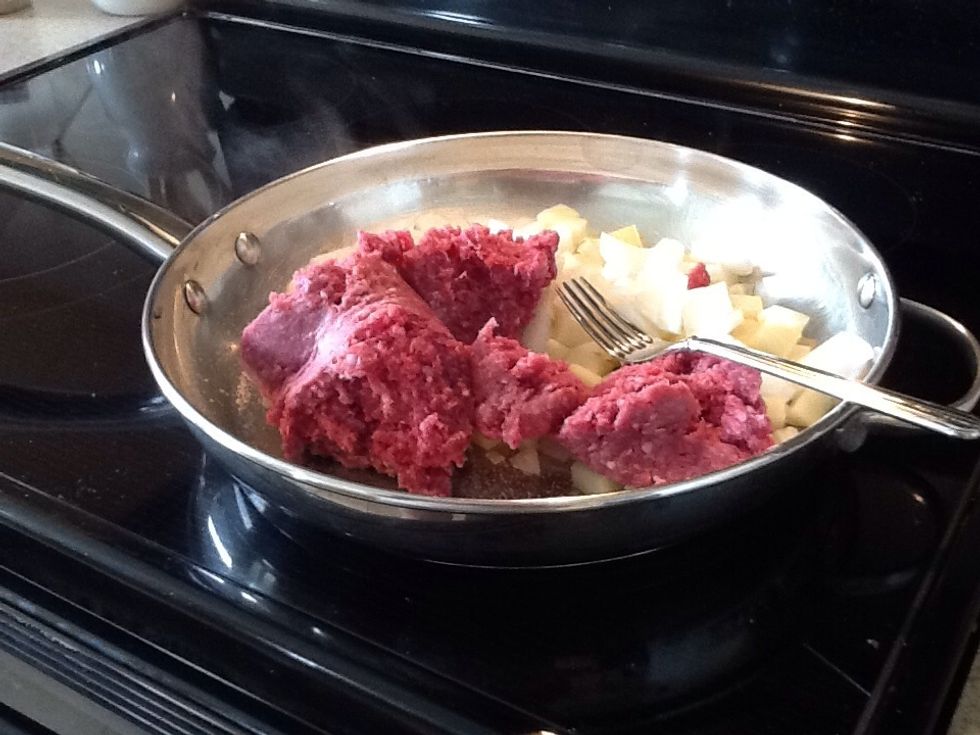 Add the meat to the onion and potato. Start "mushing" it all together. Add salt and pepper to you liking.