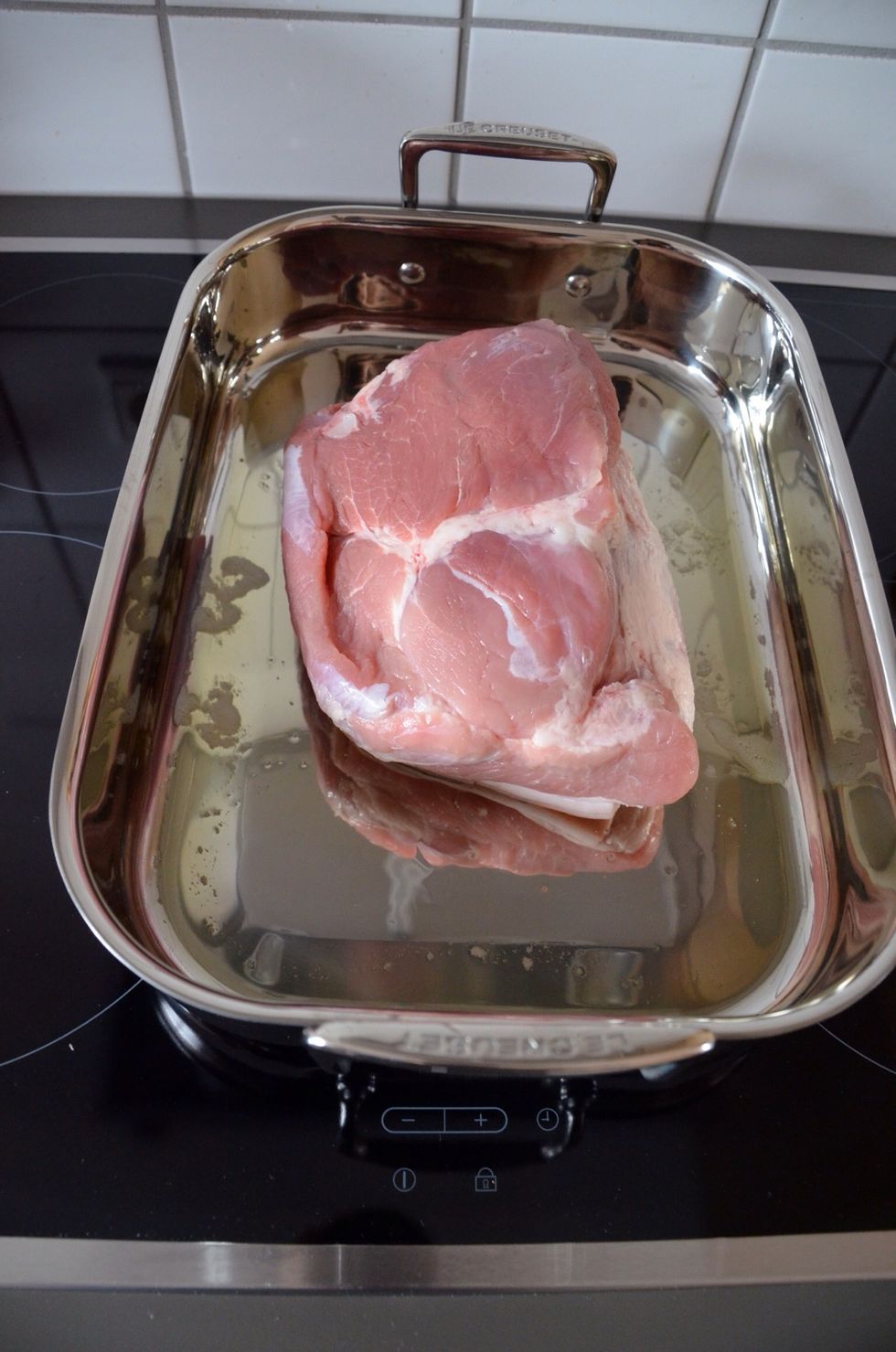 Add the meat with pork rind facing down.
