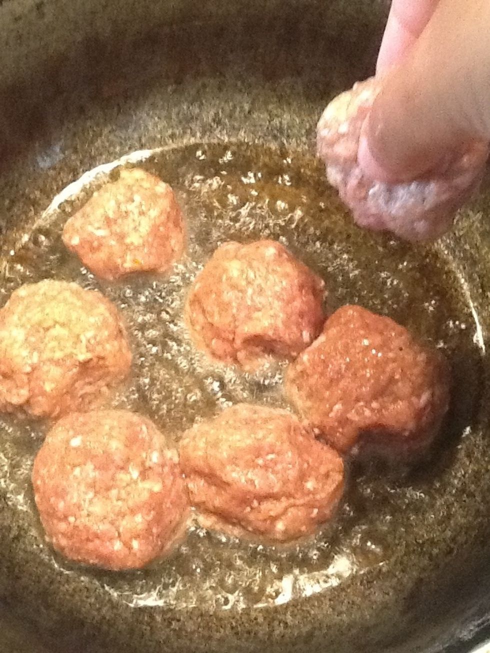 Add the meatballs to the oil. If possible use a nonstick pan when frying. They might stick to the bottom of a regular pot.