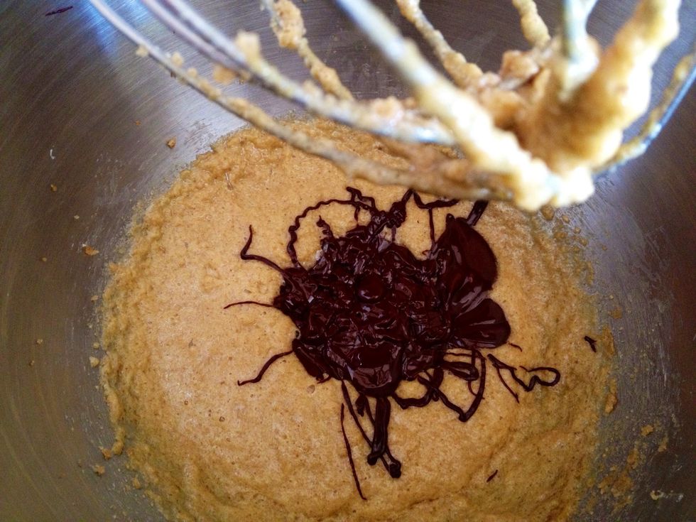 Add the melted chocolate into the butter and brown sugar mixture and mix on low speed until well combined.