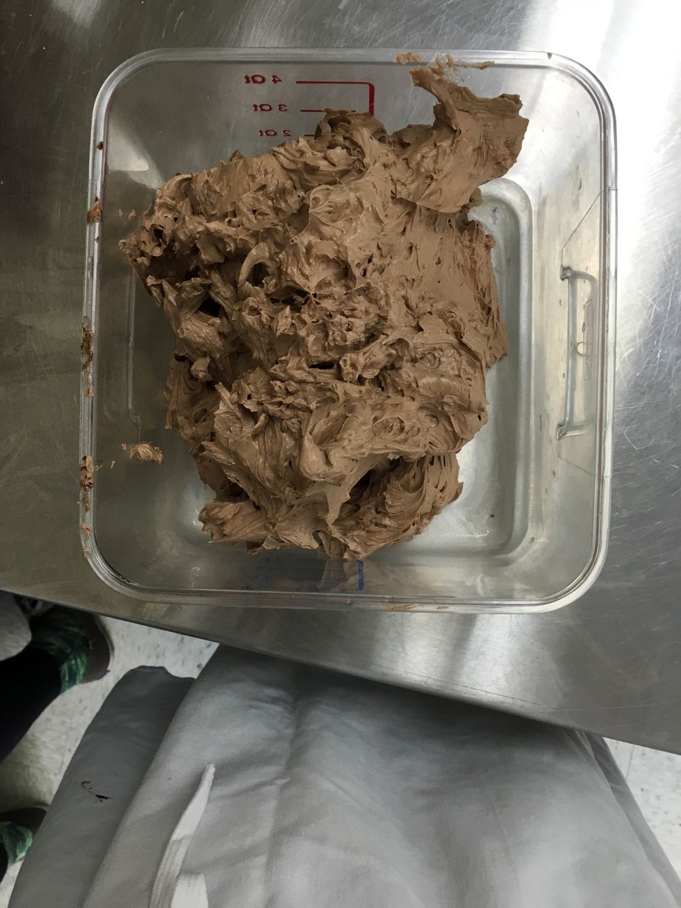Add the melted chocolate to the last of the creamed butter. Then combine the meringue buttercream and the chocolate buttercream together.