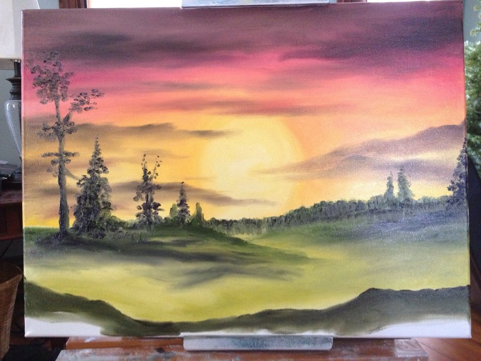 Add the middle ground land in with yellows and greens, and then use green and black for your shadows. Your foreground will be a dark mix of all four of your dark colors.