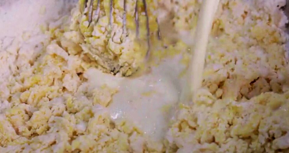 Add the milk and melted butter to the mix. Stir gently, leaving some small clumps of dry ingredients in the batter. Do not blend until completely smooth, for best results.