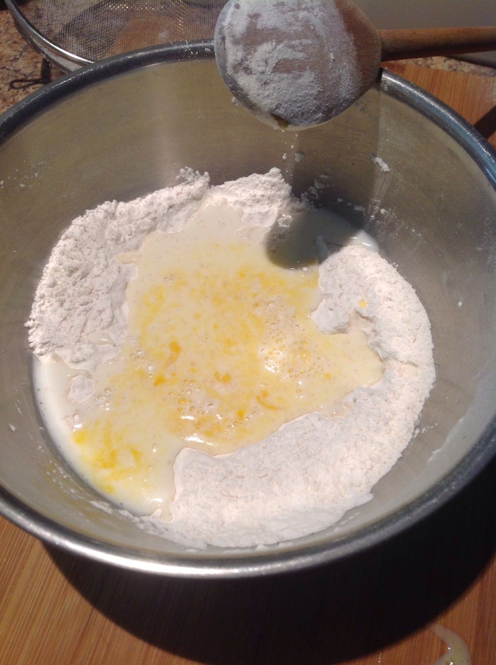 Add the milk and two tablespoons of the butter and combine