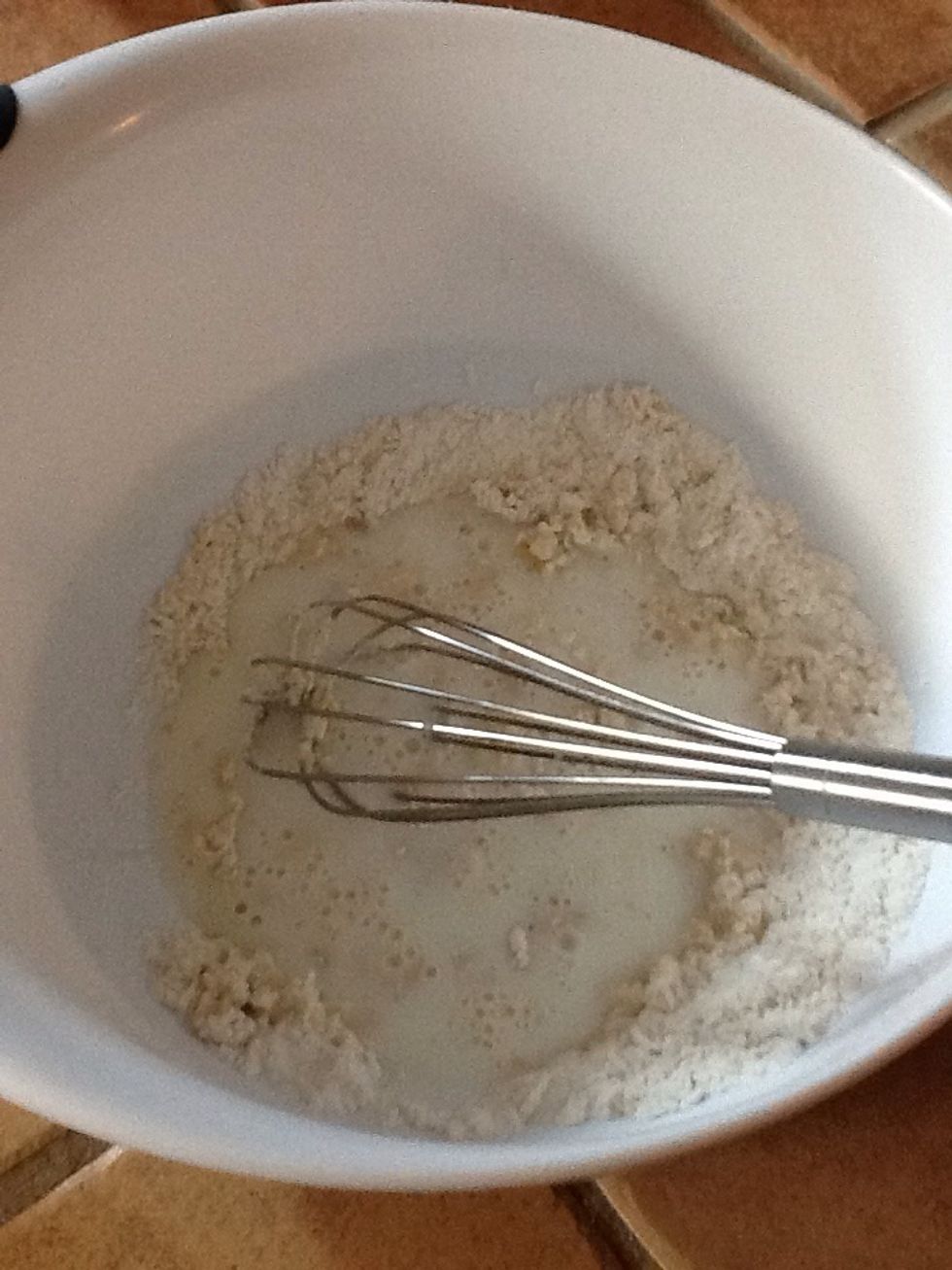 Add the milk and whisk together.