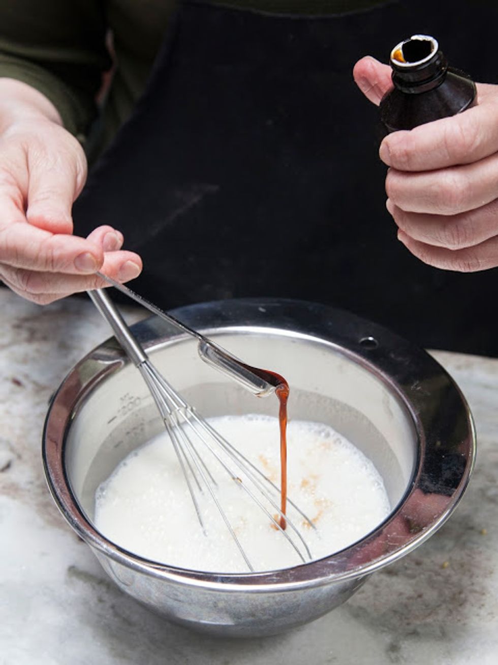 Add the milk, cream, and sugar to a large bowl. Stir everything around until it's well mixed. Add in 2 tsps of vanilla.