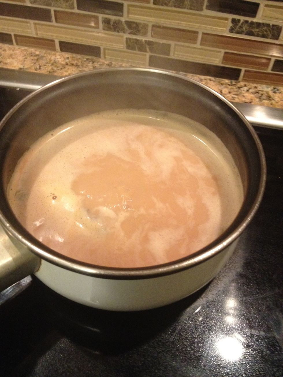 Add the milk (I use 2%) and wait until it boils. Once it reaches a boil, take it off and strain.