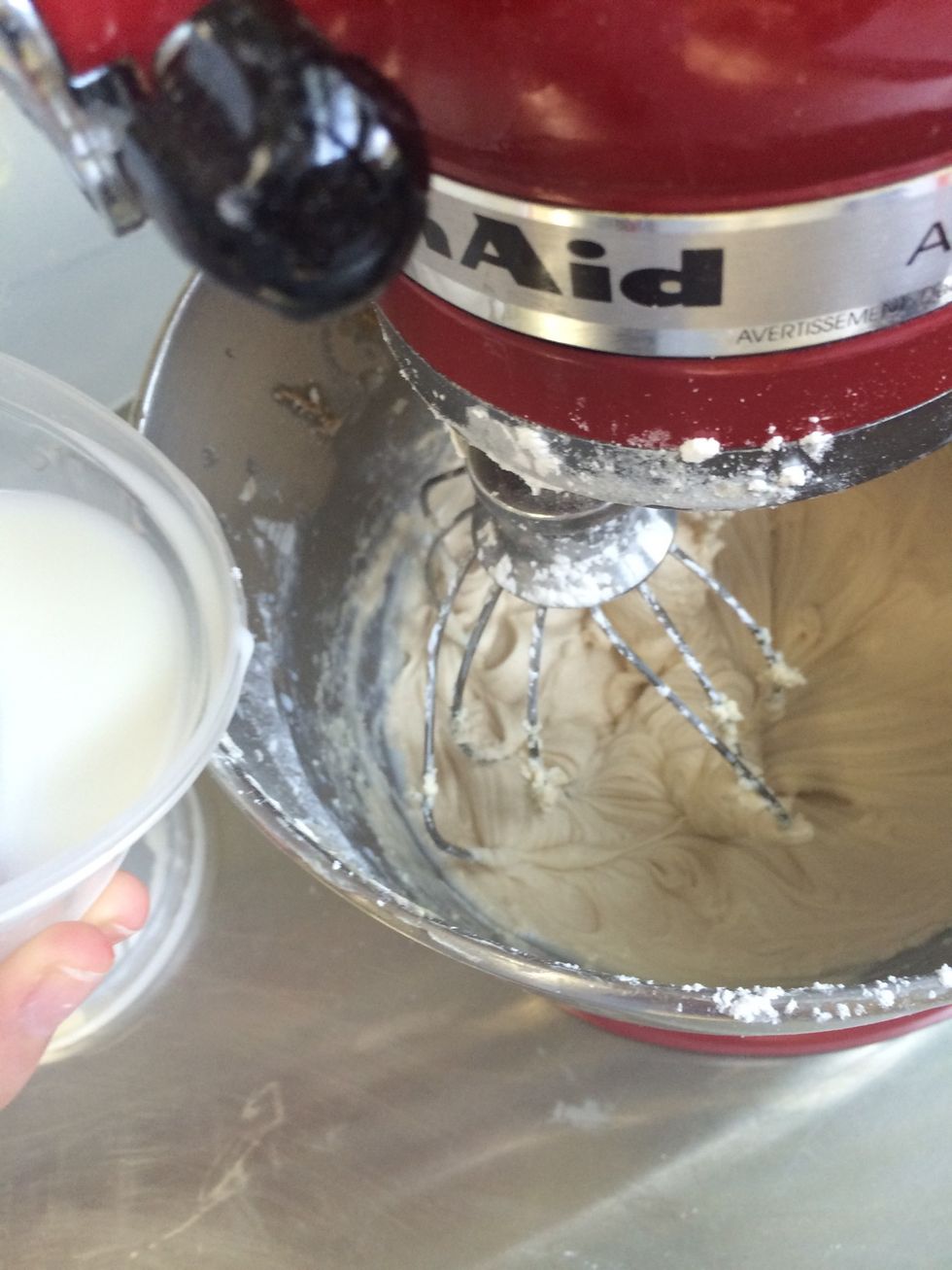 Add the milk in, one tablespoon at a time.