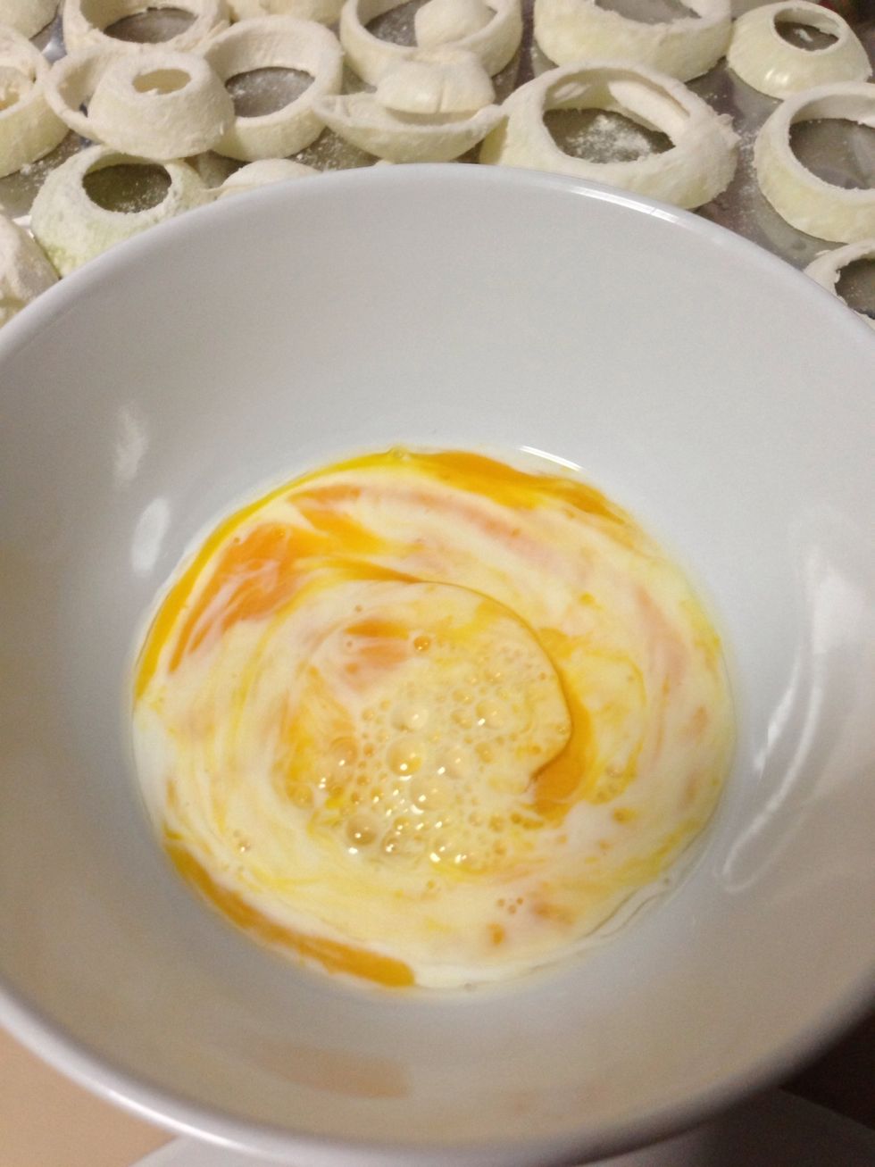 Add the milk to the egg and seasoned with salt & pepper, you may add other spices as well. Whisk until combined.