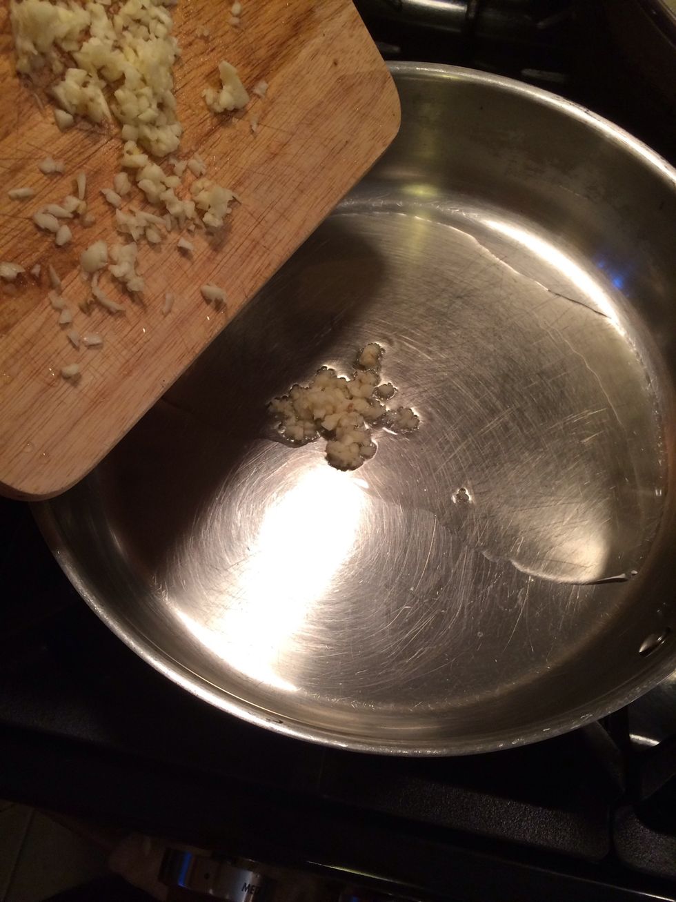 Add the minced garlic, cook it for a minute