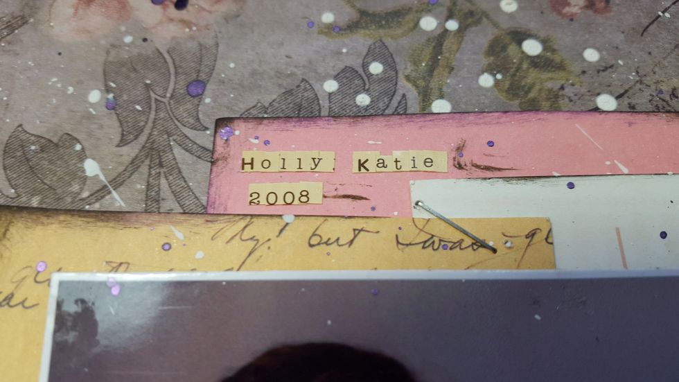 Add the mini alpha stickers to the top of the journal cards. At this point I did some more splatting with the Lilac Night mist(make sure your photo is covered up) and some gesso splats too!