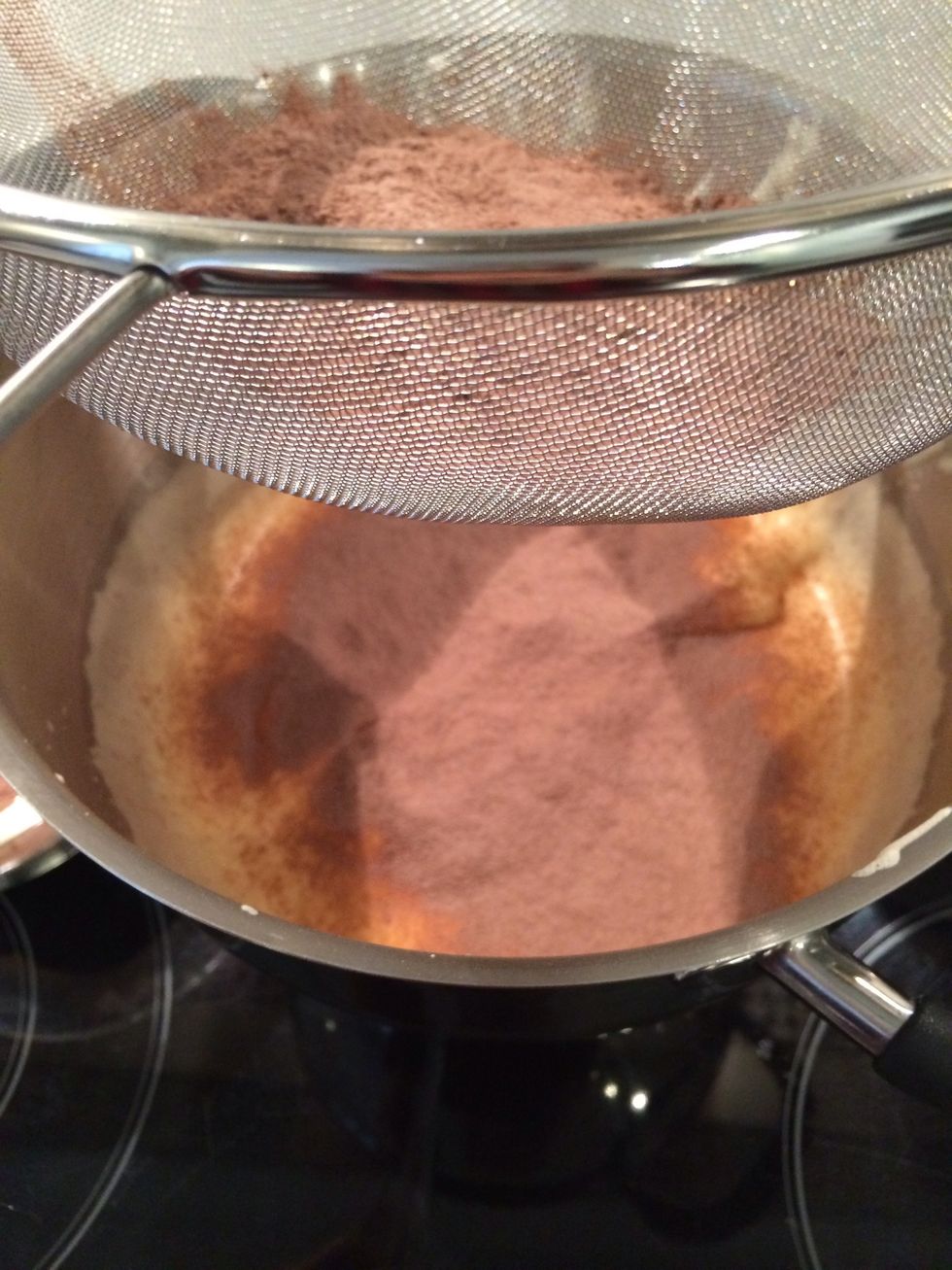 Add the mix flour and suger in 3-4 times folding in gently wit a spatula or a whisk.. Better a spatula I found out.