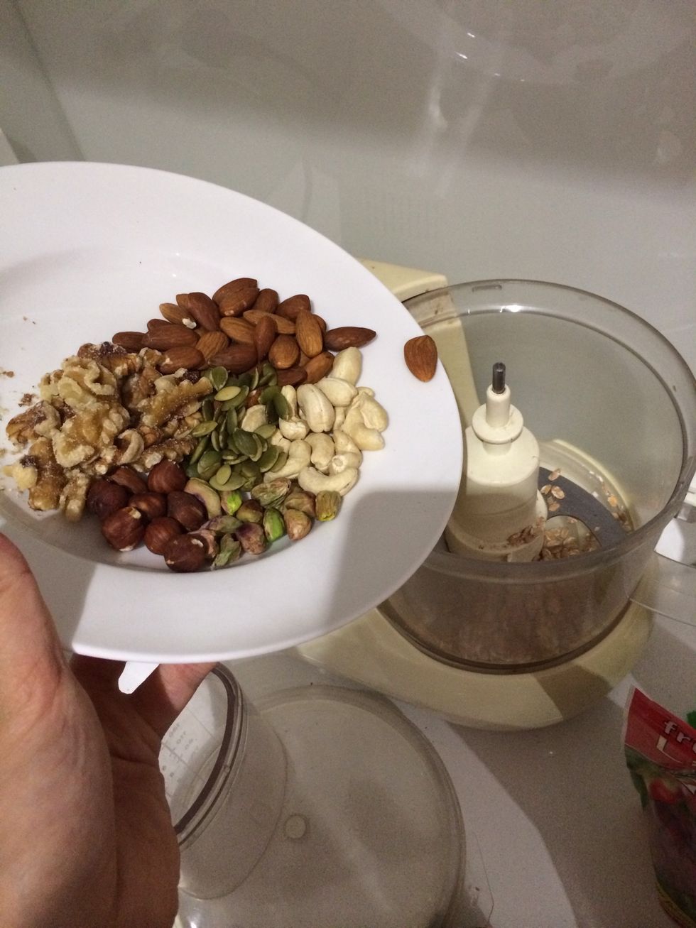 Add the mixed nuts to the blended rolled oats