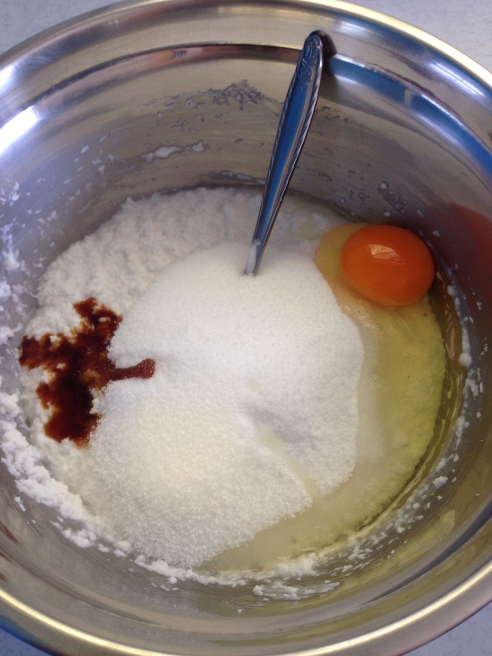 Add the Natvia, vanilla extract and the egg to the coconut mix and stir well.