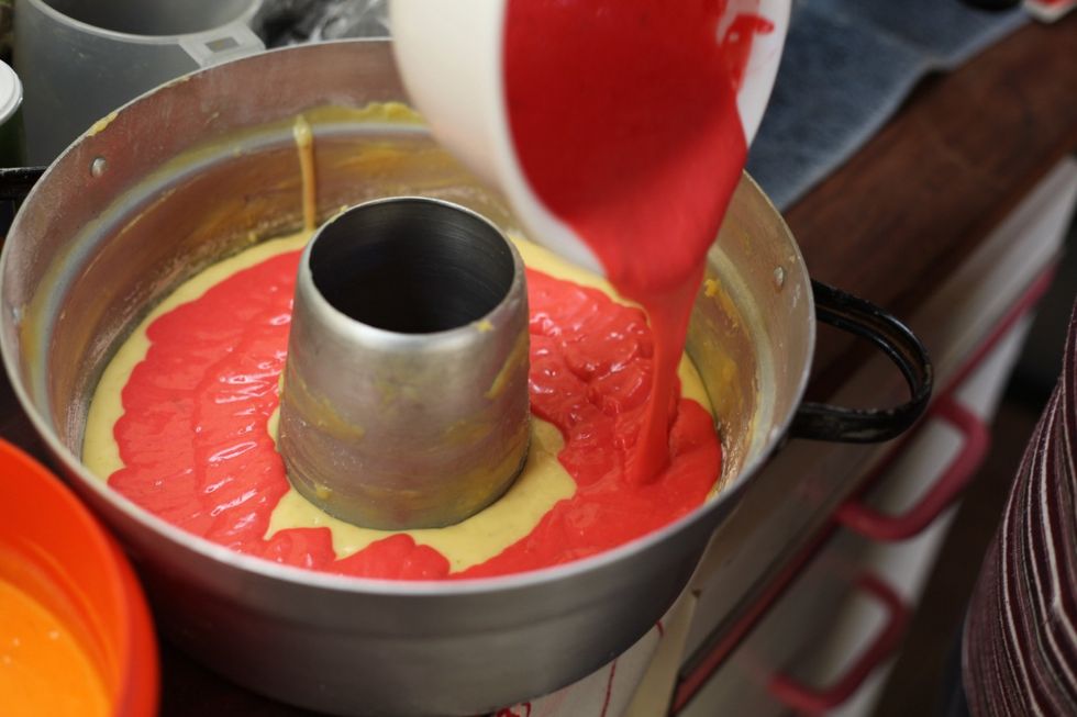 Add the next colour of choice to your baking tray. Add a few white chocolate chips.