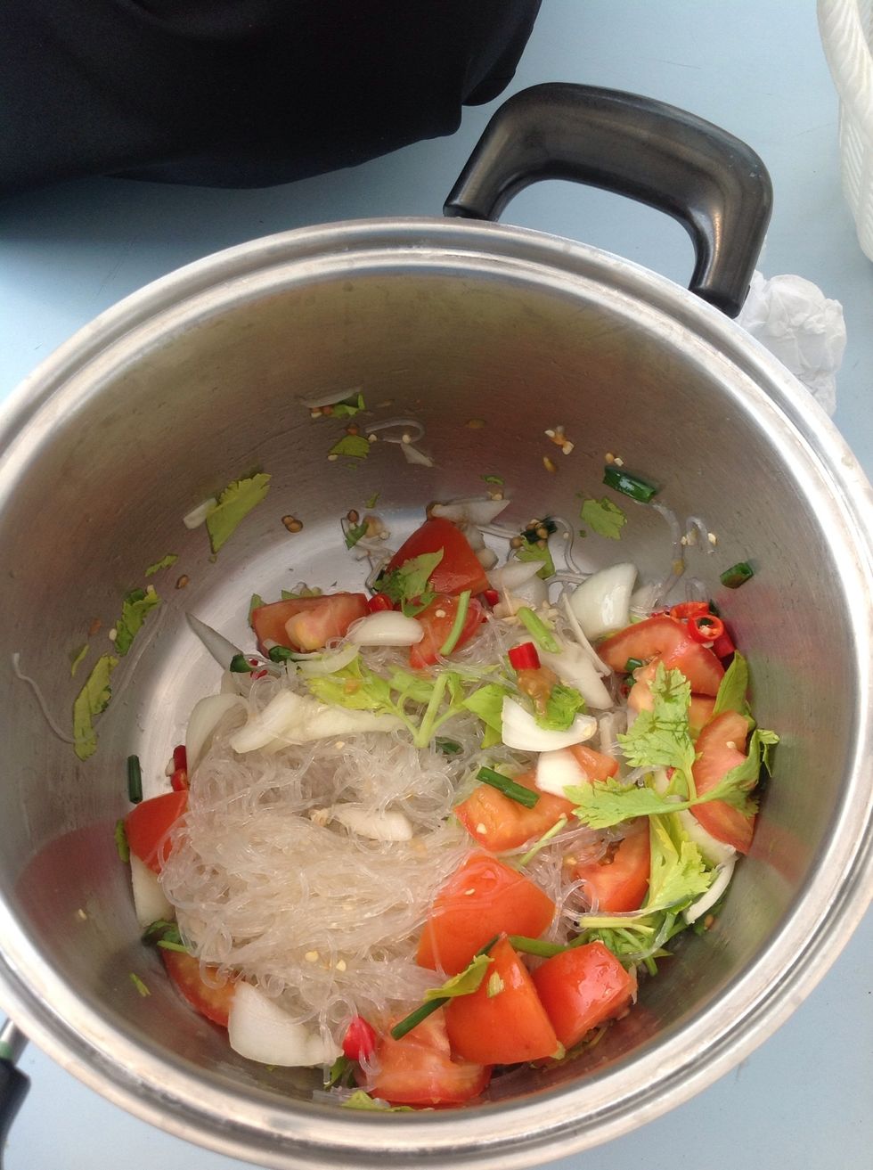 Add the noodles and  mix together and then taste it. When you have the  taste that you want you can serve it. You can serve it with plain rice or only with the noodles. It's up to you. Enjoy!