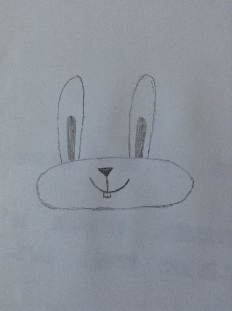 Add the nose, mouth and teeth. I recommend you make the nose triangular!