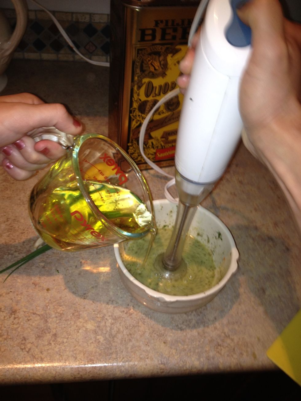 Add the oil slowly as you blend. I'm using a immersion blender but a food processor or blender will work. The final product will be a creamy dressing. Let stand at room temp while you make the salad.