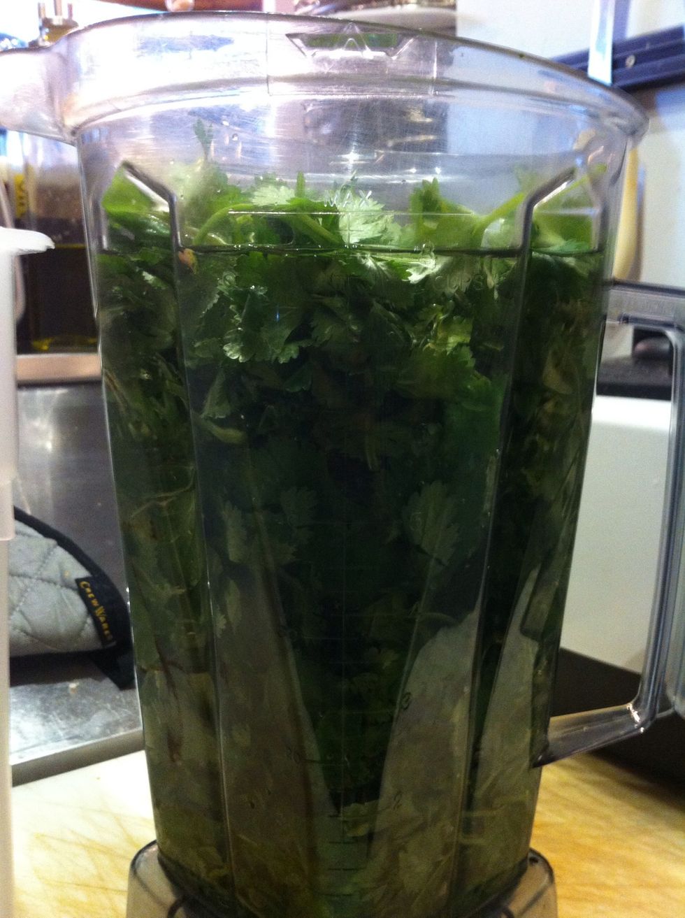 Add the oil to the cilantro in the blender.