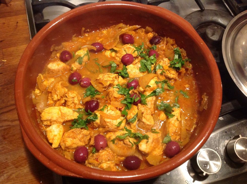 Add the olives after about 8-10 mins from adding the chicken breast then cook a further 5-7 mins adding the leaf coriander and parsley.