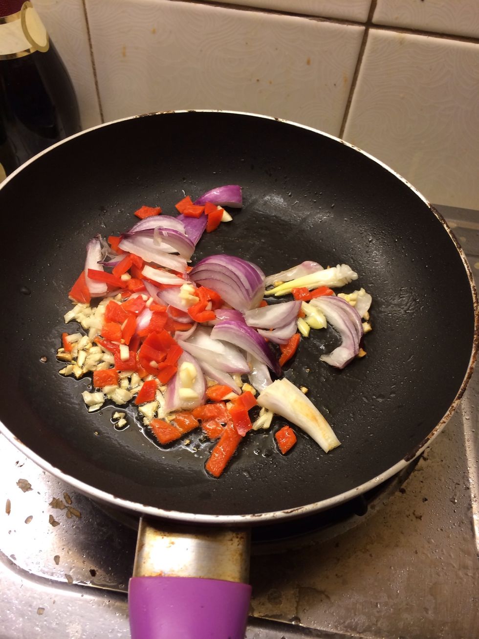 Add the onion and 3/4 of the bell pepper wait till onion turns translucent