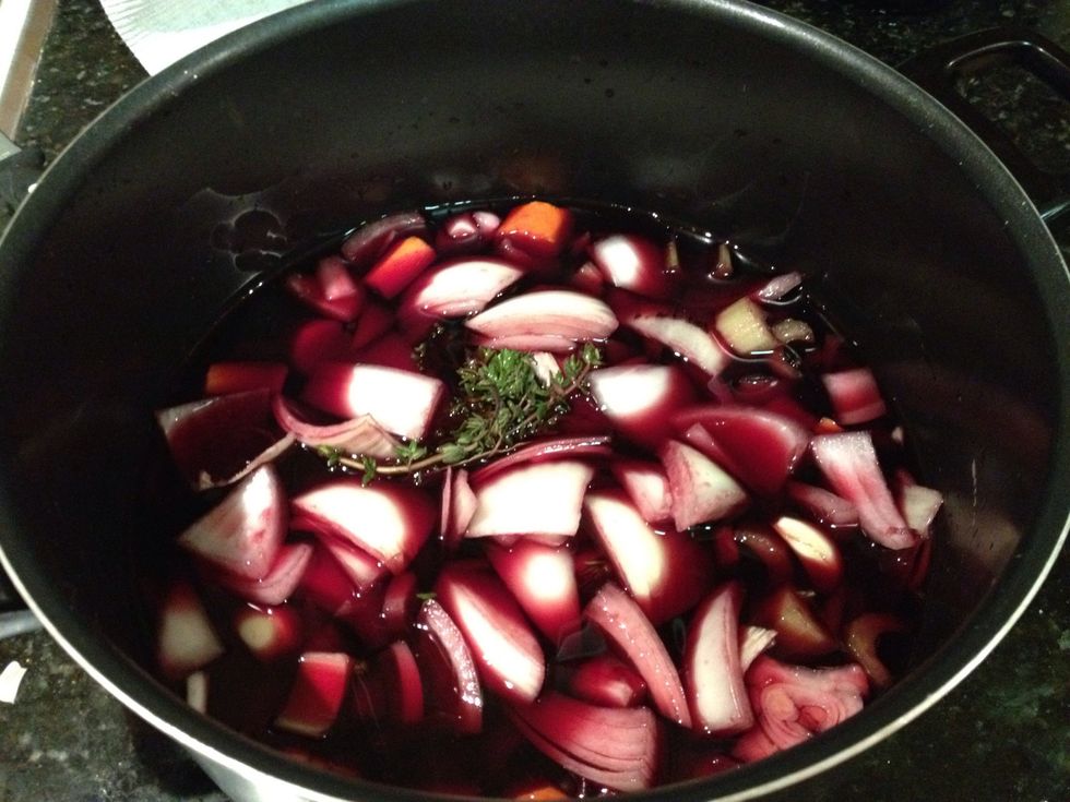Add the onion, carrot, celery, black peppercorn and bouquet garni to the pot.