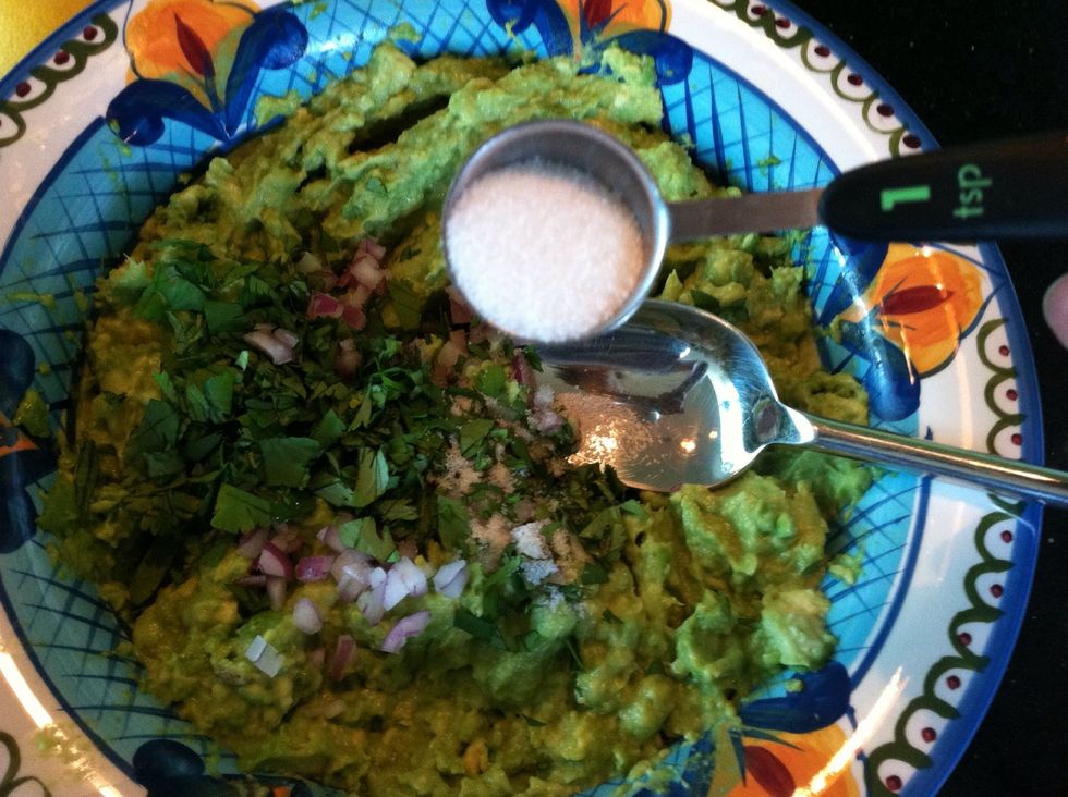 Add the onion, cilantro and a teaspoon of salt to the avocado in the bowl.