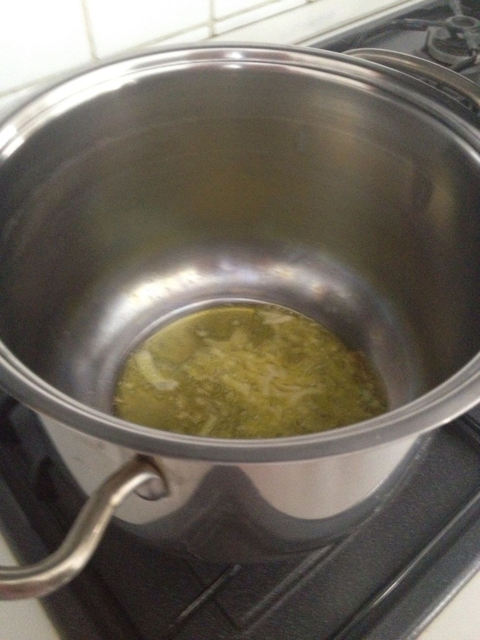 Add the onion in the pot and switch on the stove and let the onion fry