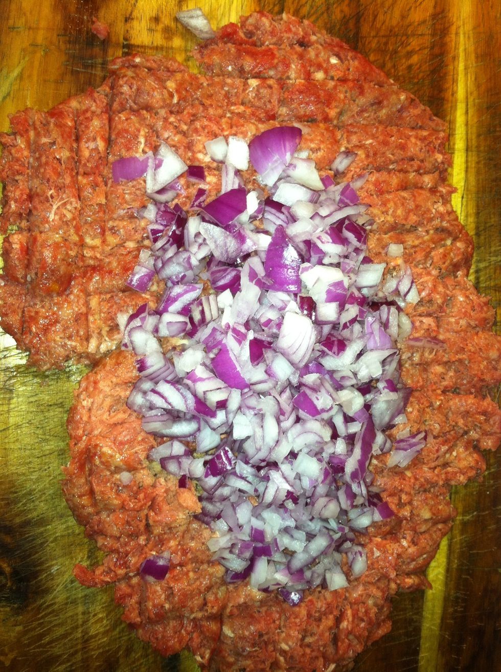 Add the onion pieces and mix the hamburger together.