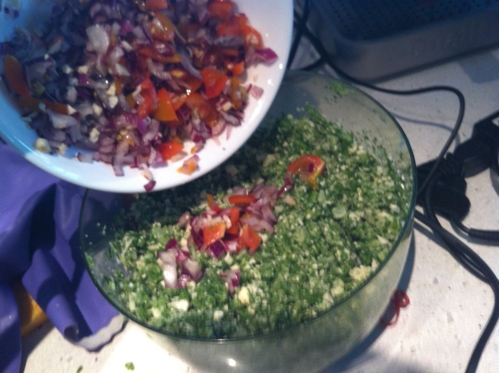 Add the onion, tomato and garlic to the parsley mix.