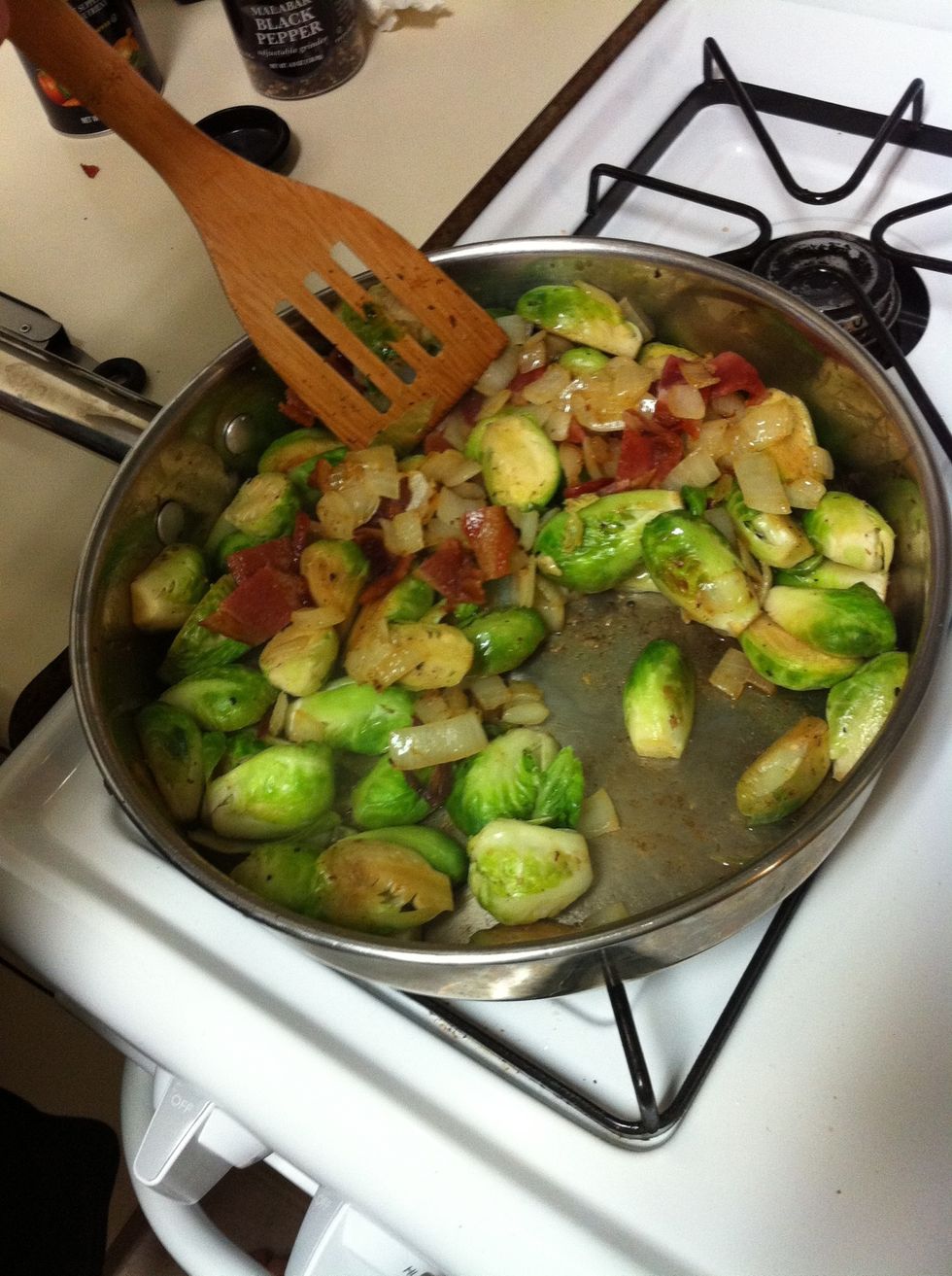 Add the onions and bacon to the sprouts and cook covered until your brussels sprouts are tender. Be sure to stir regularly. Once finished move to a plate and serve. There shouldn't be much liquid left