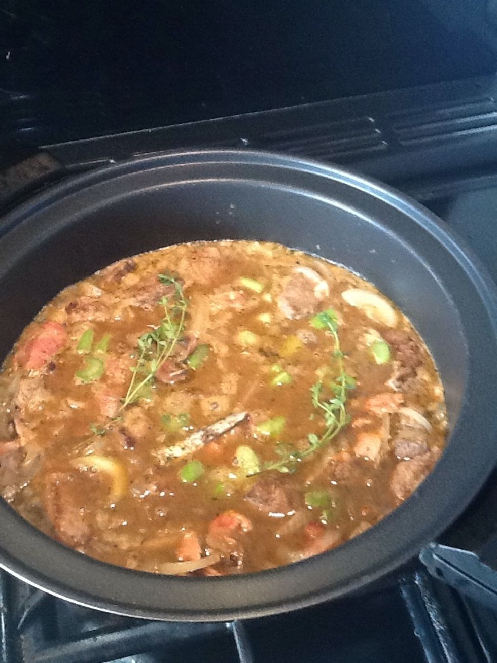 Add the onions, bacon, stock, cider, cayenne pepper, anchovies, thyme, celery and black treacle to the stewing pan, put a lid on it and simmer the mixture for 2 hours