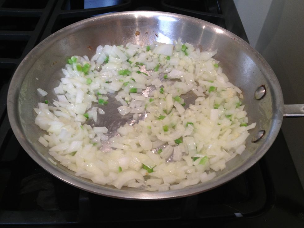 Add the onions, jalape\u00f1os and garlic to the skillet. Cook for about 6 or 7 minutes, until soft.