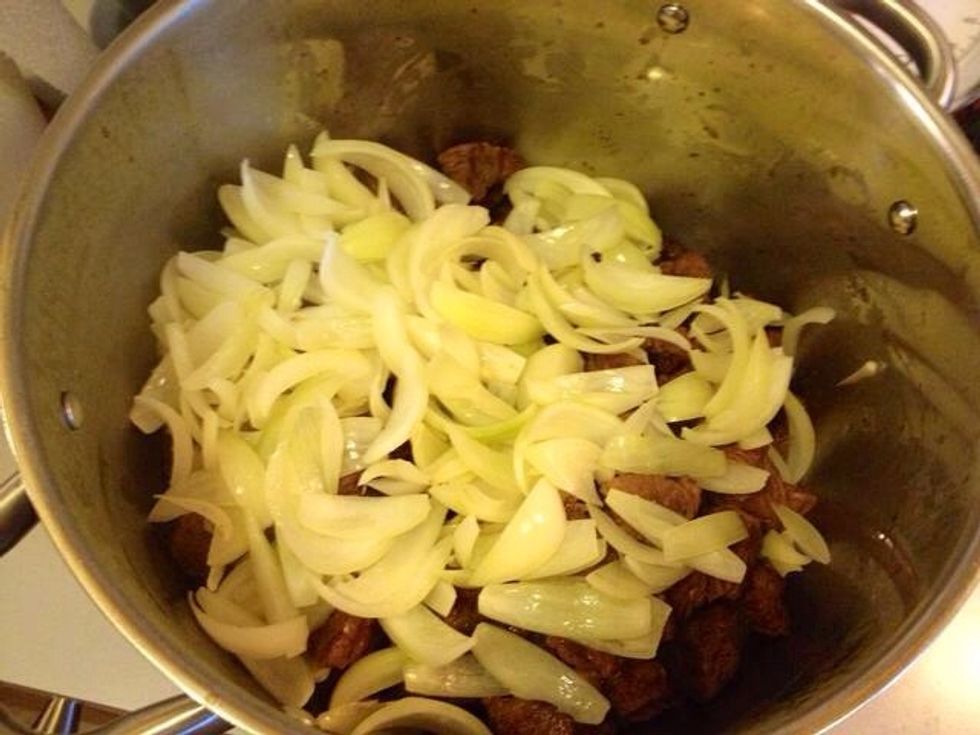 Add the onions to the meat.