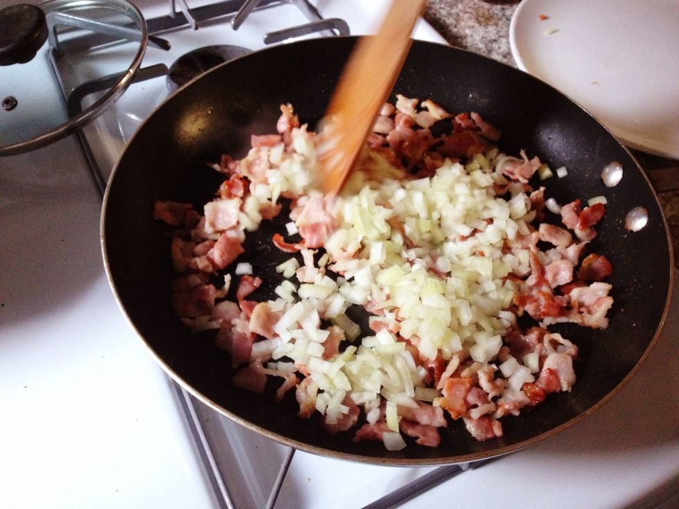 Add the onions to the pan along with a pinch of salt, stir well. Cook until the onion sweats (softened and translucent).