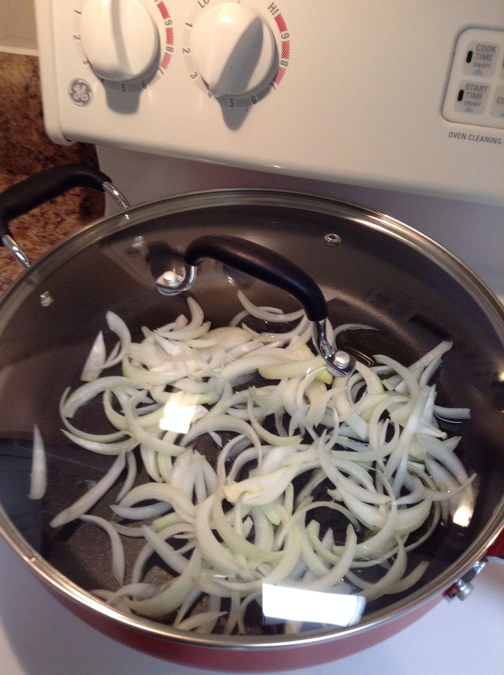 Add the onions to the pan and cover for 5 min.
