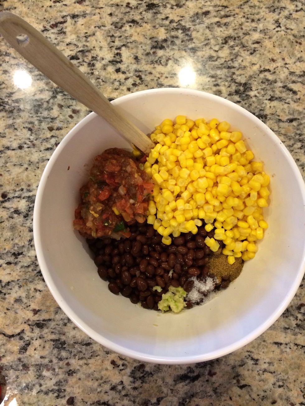 Add the other can of black beans, salsa,corn, salt, garlic and cumin