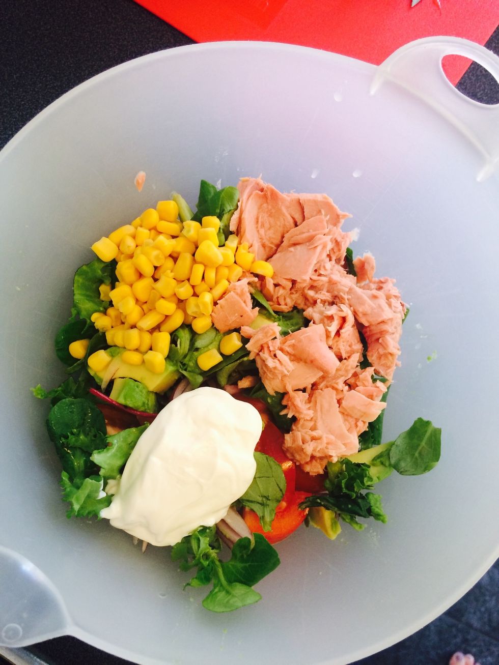 Add the other ingredients (tuna, corn, sour cream and spice(s).
