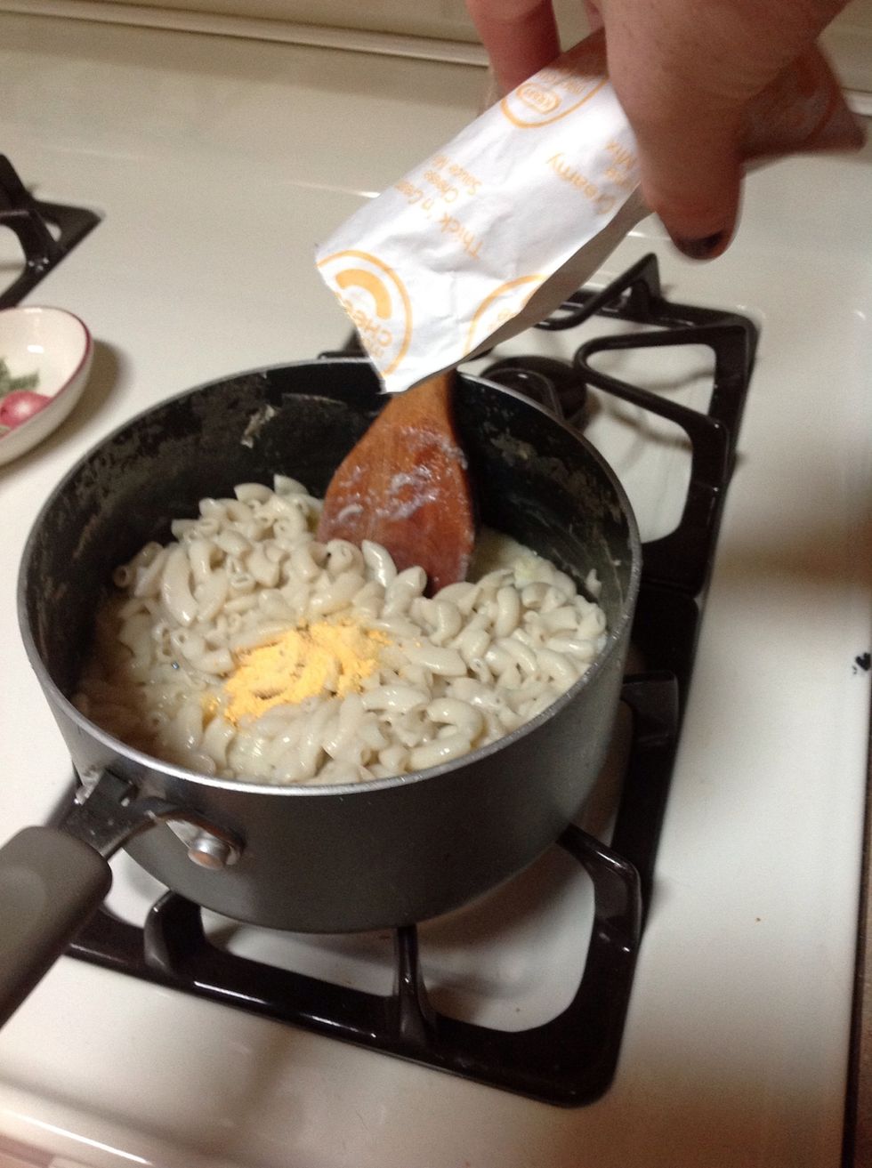 Add the pack of cheese.