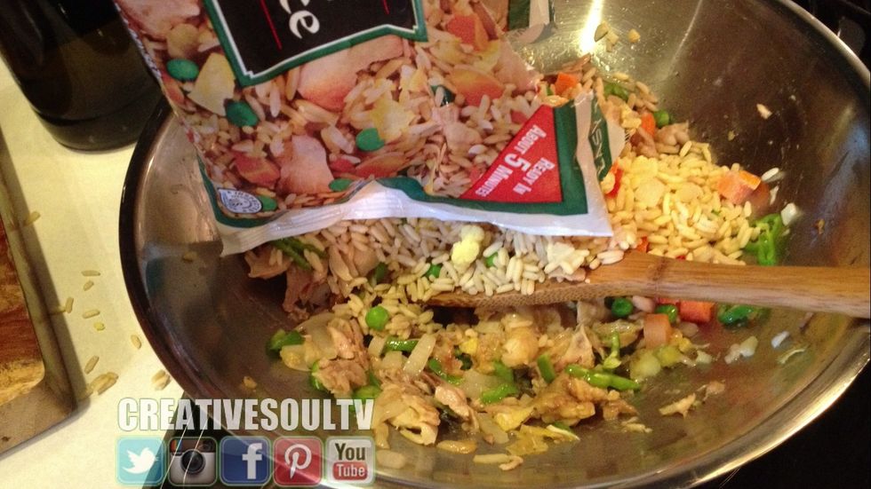 Add the package of chicken fried rice & continue to stir fry everything until your rice is cooked.