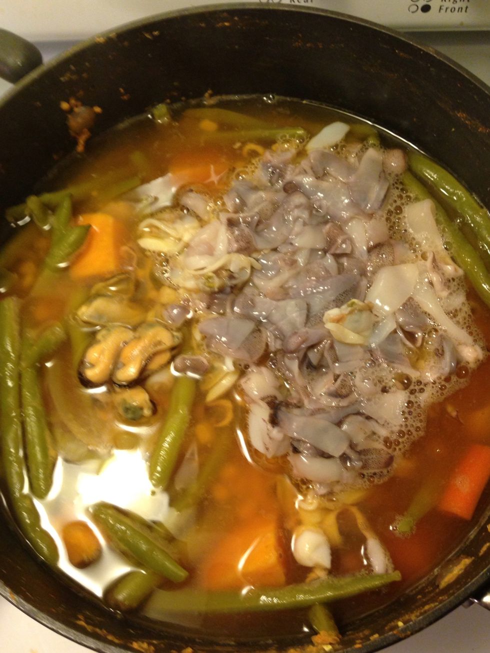 Add the packages of seafood mix and cook on high for 3 more minutes. Turn the stove off and leave it setting for 5! Then serve.