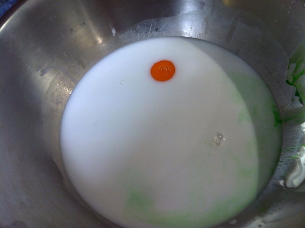 Add the pandan extract. It makes the cake mild green in colour & gives it a sweet aroma.