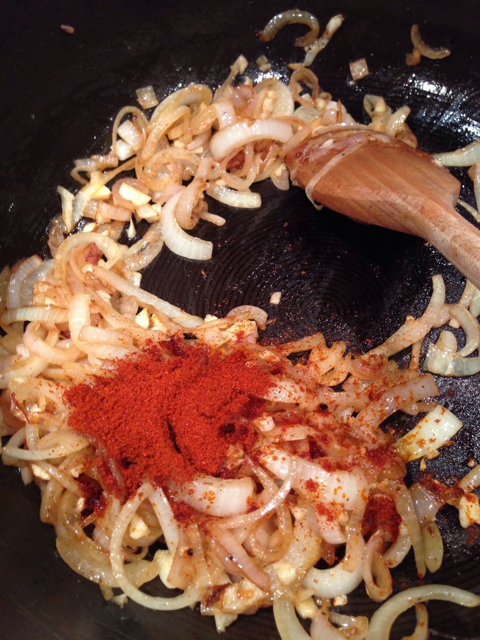 Add the paprika and fry with the onions and garlic for a minute