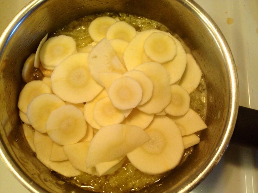 Add the parsnip to the sauce base. Boil until the chopped parsnip is soft.