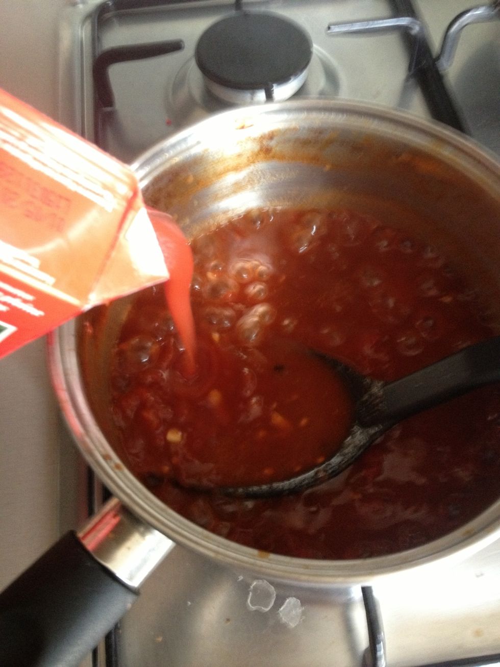 Add the passata or tomato pur\u00e9e to the mixture and combine.