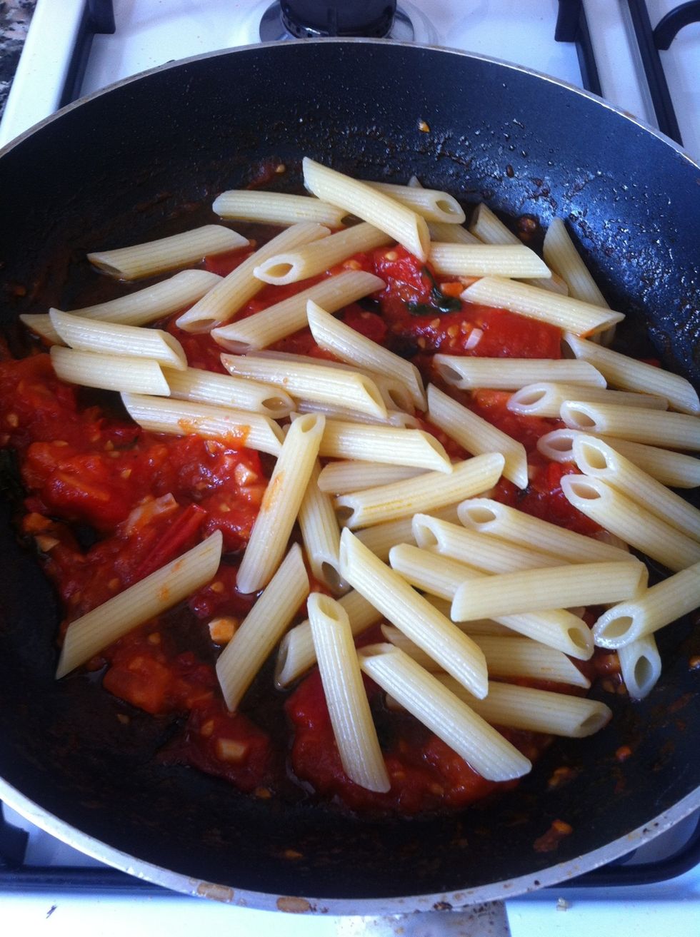 Add the pasta to the frying pan and coat the pasta with the sauce over a medium heat