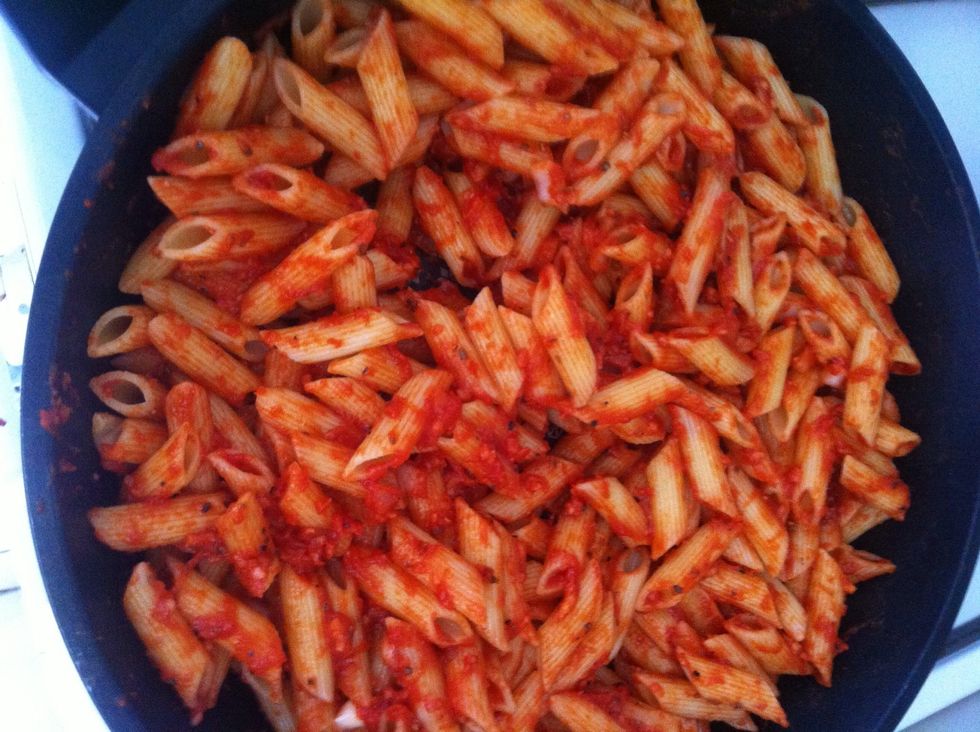 Add the pasta to the sauce and constantly mix at a low flame.