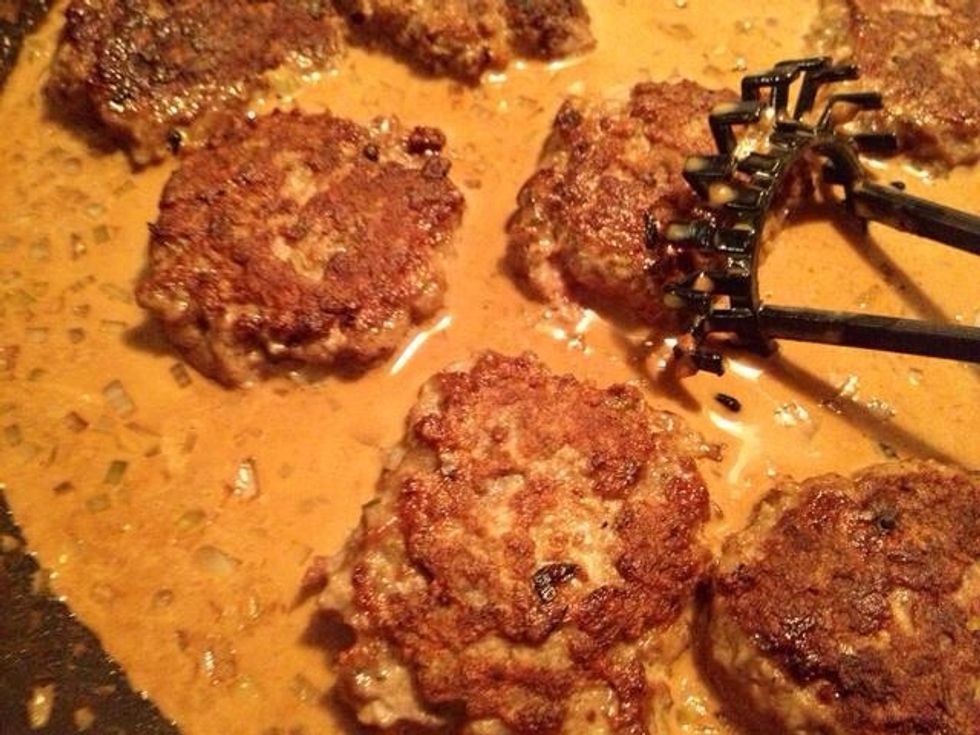 Add the patties to the sauce.