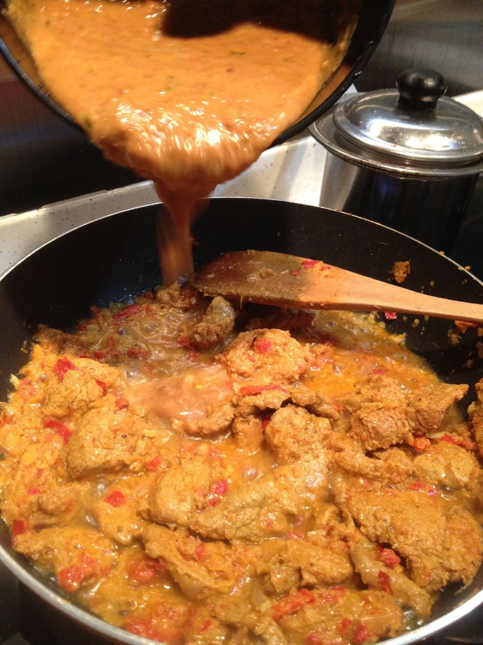 Add the peanut sauce that you prepared before. Wait until the meat is tender.